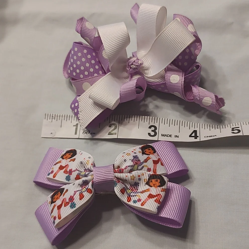 Dora the Explorer and polka dot purple bow lot x 2